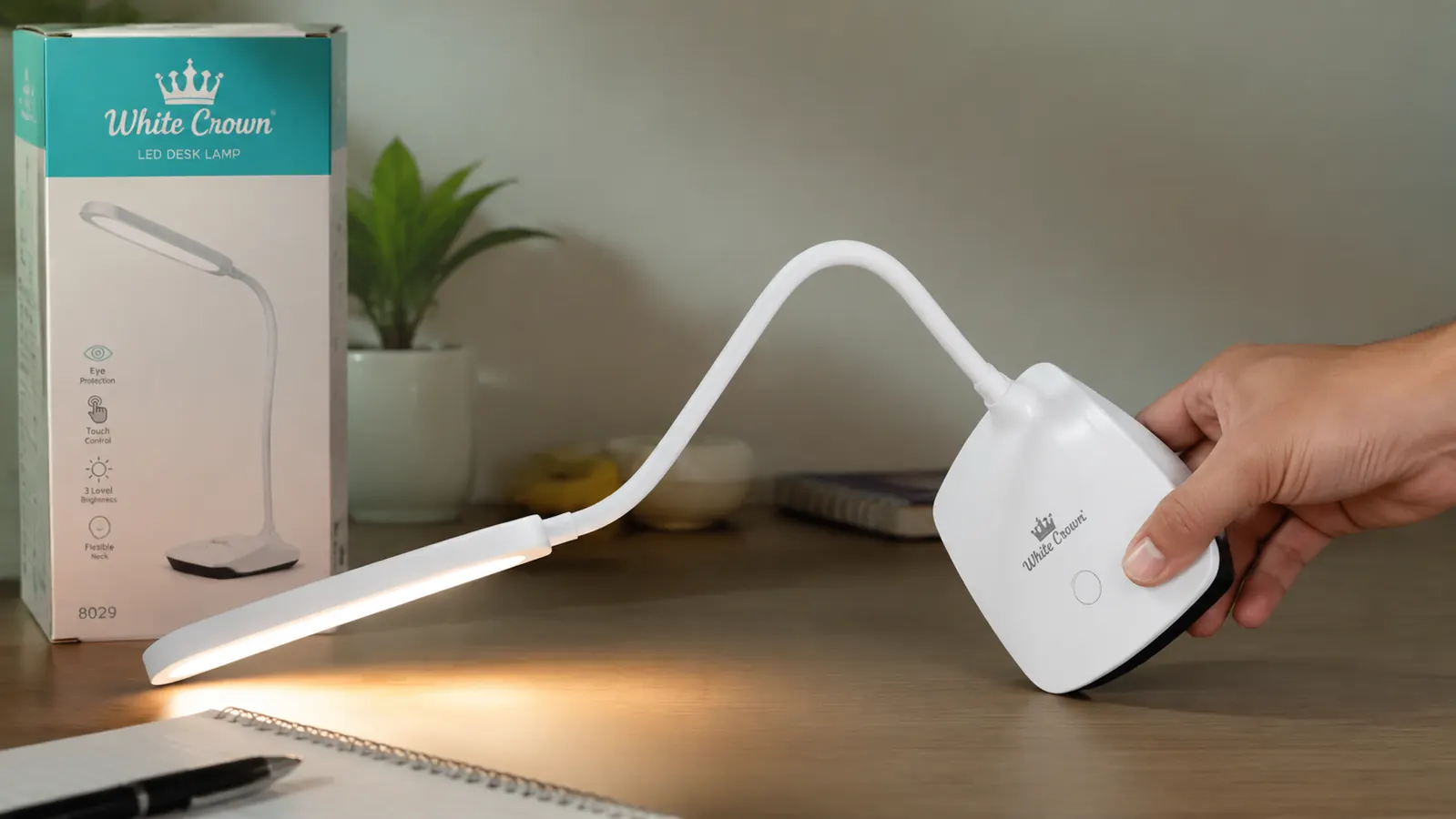 Close-up of the White Crown lamp neck at a steep angle showing the flex joint, demonstrating the arm geometry limit
